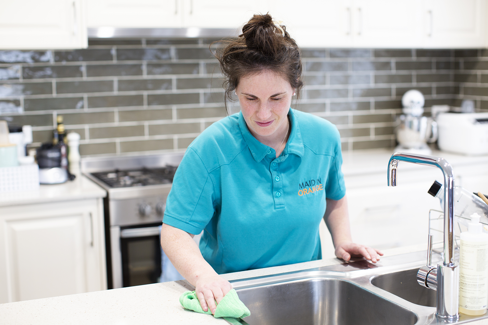 Woman cleaning the kitchen